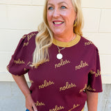 Women's garnet puff sleeve knit sweater featuring scattered gold cursive FSU lettering and a classic crew neckline.