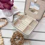 Leather jewelry box designed to showcase a 4 by 4 inch needlepoint 