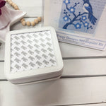 Leather jewelry box designed to showcase a 4 by 4 inch needlepoint 