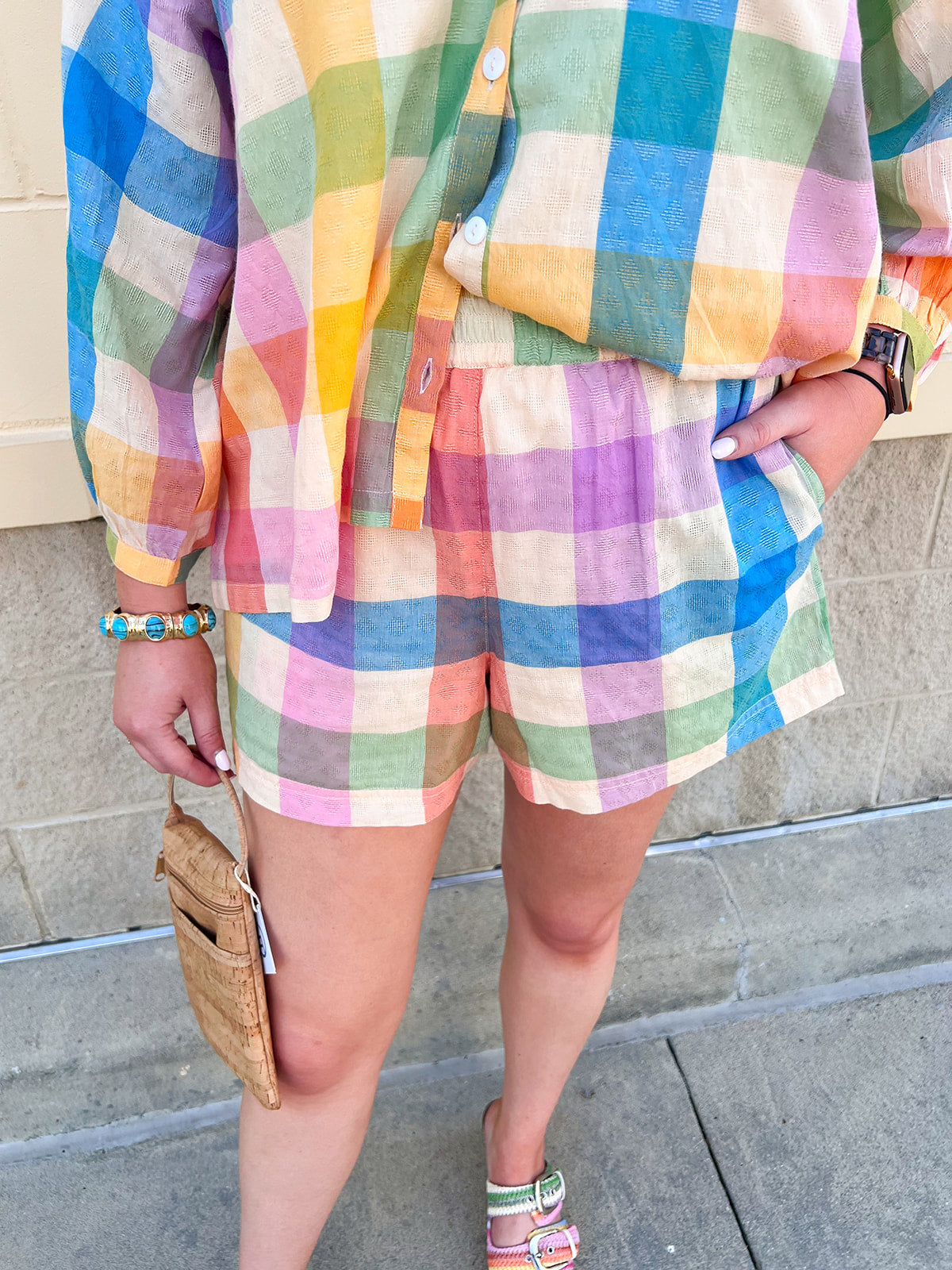 Rainbow plaid Bermuda shorts featuring a vibrant multicolor woven pattern and relaxed tailored fit.