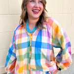 Rainbow plaid lightweight top featuring a colorful multicolor woven pattern and relaxed silhouette.