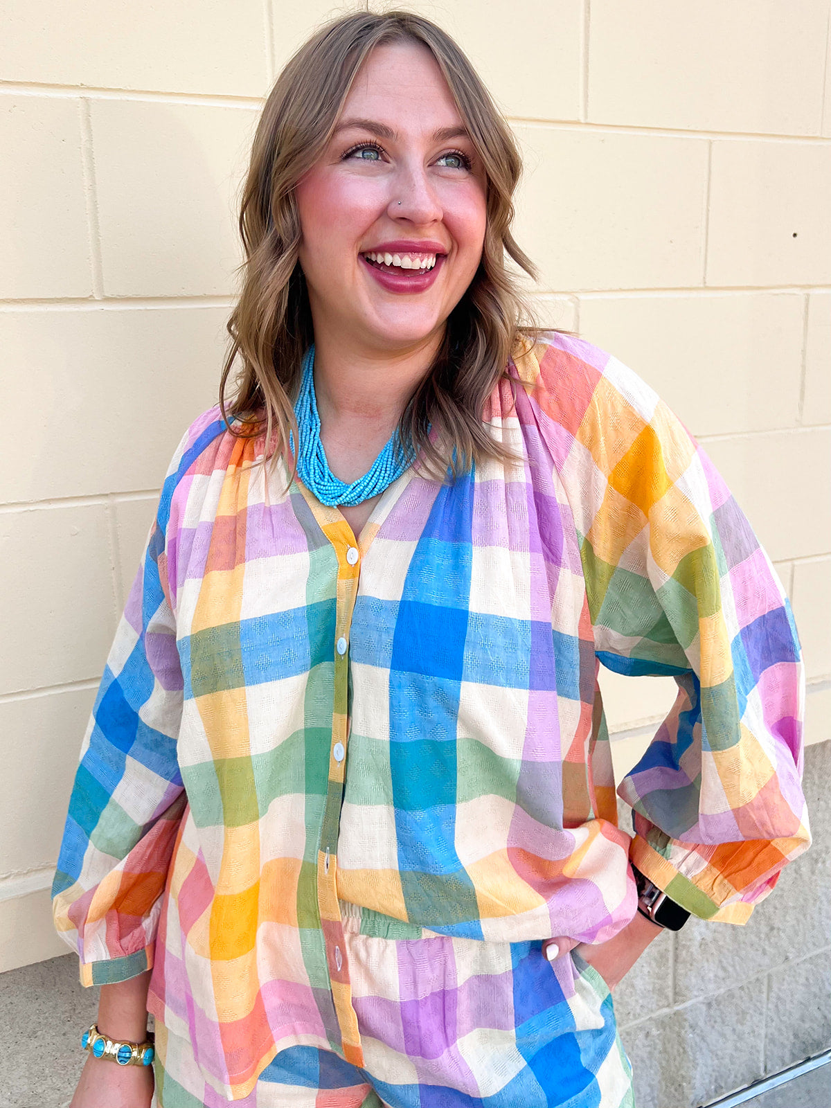 Rainbow plaid lightweight top featuring a colorful multicolor woven pattern and relaxed silhouette.