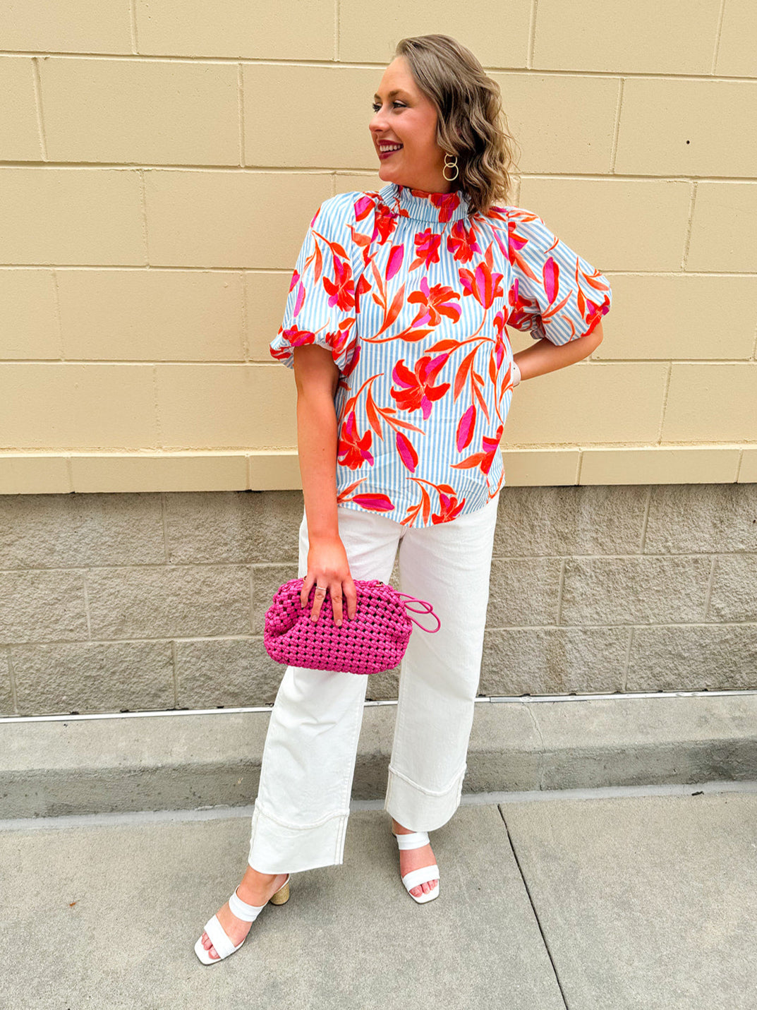Floral striped blouse with puff sleeves, ruffle collar, and gold button details—vibrant, feminine boutique style.