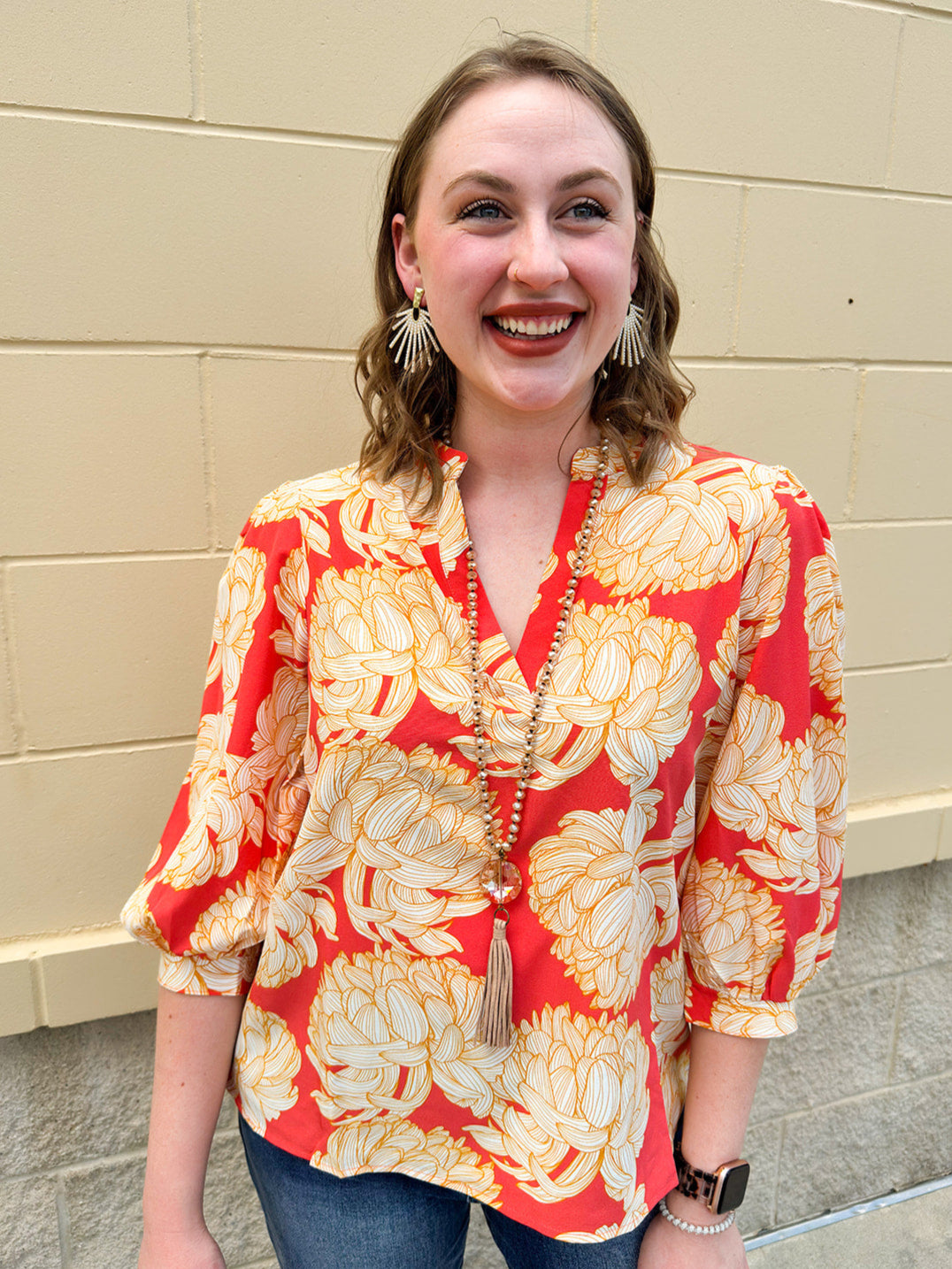 Floral blouse with caftan neckline in pink, tan, and cream fall pattern.