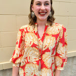 Floral blouse with caftan neckline in pink, tan, and cream fall pattern.