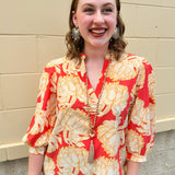 Floral blouse with caftan neckline in pink, tan, and cream fall pattern.