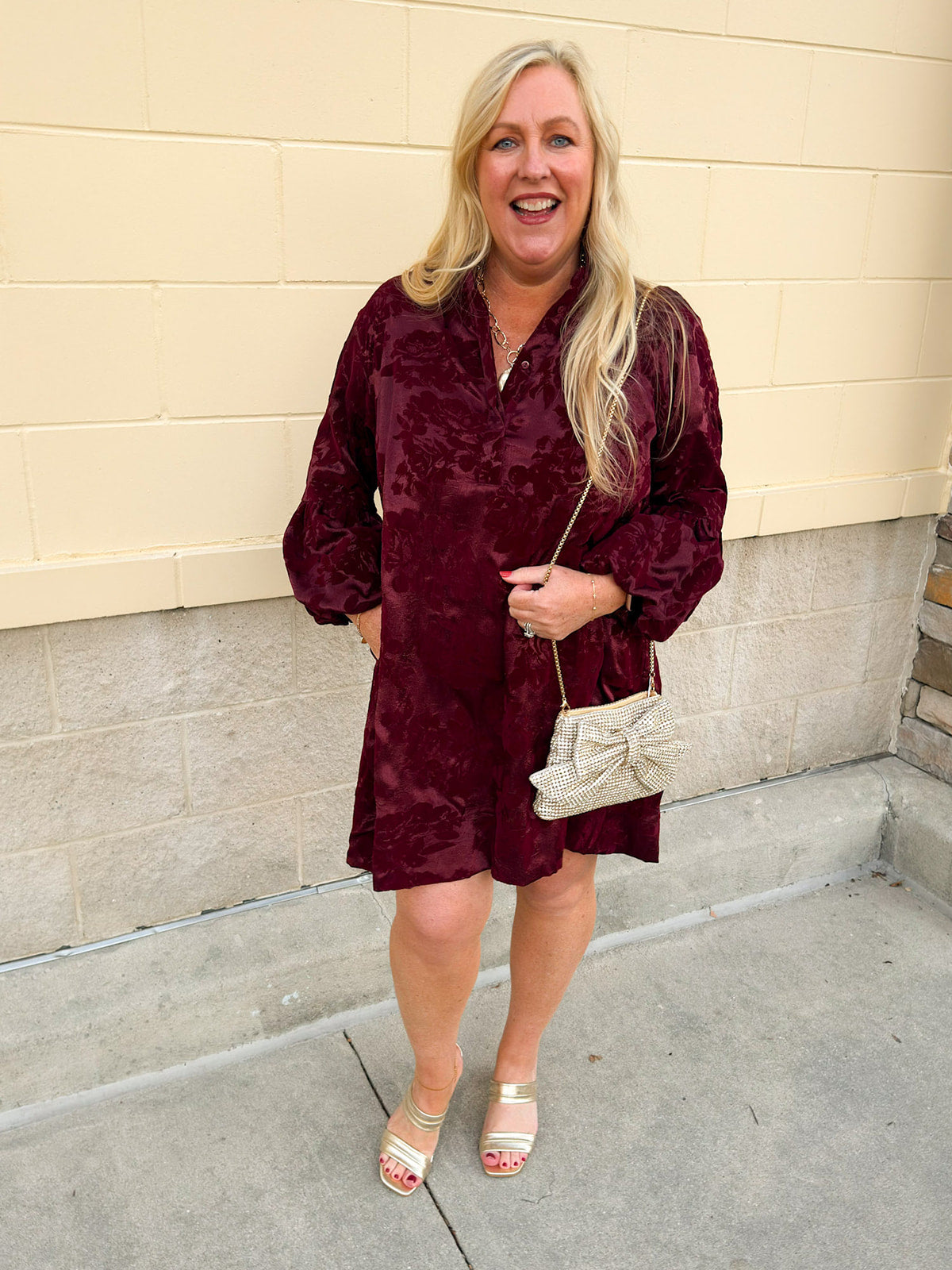 Garnet velvet mini dress with tone-on-tone floral jacquard, ruffle collar, button-down neckline, and puff 3/4 sleeves.