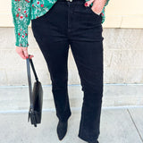 Women’s mid-rise velvet bootcut jeans in a classic fit, styled for dressy or casual occasions.