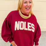 Garnet fleece crewneck sweatshirt featuring oversized gold FSU collegiate graphics with vintage chenille detailing and a relaxed fit.