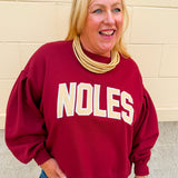 Garnet fleece crewneck sweatshirt featuring oversized gold FSU collegiate graphics with vintage chenille detailing and a relaxed fit.