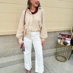 Tan and off-white striped long sleeve button-down shirt with collared neckline and cuffed sleeves—lightweight and perfect for layering