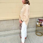 Tan and off-white striped long sleeve button-down shirt with collared neckline and cuffed sleeves—lightweight and perfect for layering
