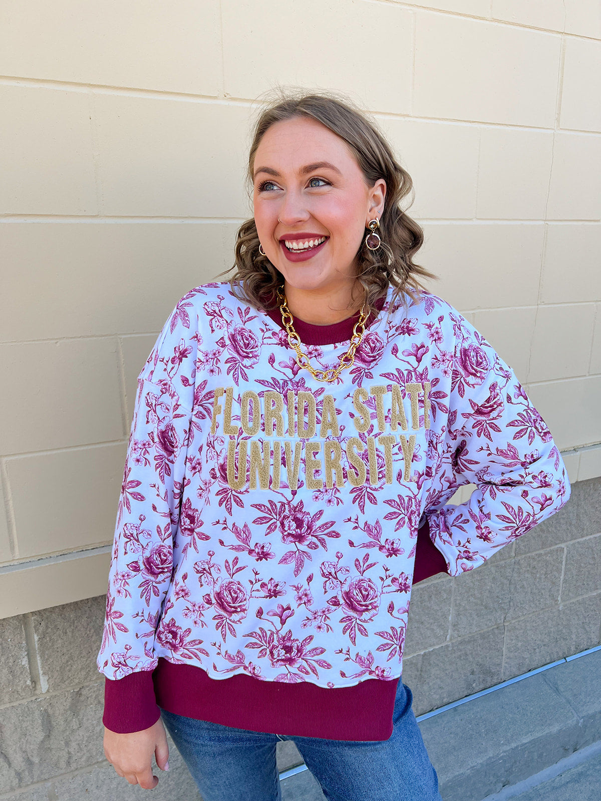 Garnet and white floral toile crewneck sweatshirt with gold chenille Florida State University lettering.