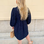 Navy embroidered mini dress with v-neck, ruffle collar, and ¾-length cuffed sleeves