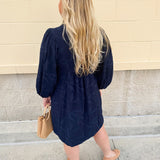 Navy embroidered mini dress with v-neck, ruffle collar, and ¾-length cuffed sleeves