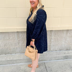 Navy embroidered mini dress with v-neck, ruffle collar, and ¾-length cuffed sleeves