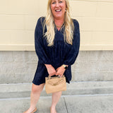 Navy embroidered mini dress with v-neck, ruffle collar, and ¾-length cuffed sleeves