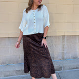 White long-sleeve knit sweater with contrasting brown buttons