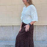 White long-sleeve knit sweater with contrasting brown buttons