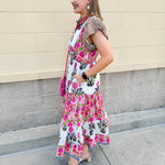 White cotton floral tiered maxi dress with flutter sleeves and ruffle collar
