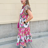 White cotton floral tiered maxi dress with flutter sleeves and ruffle collar