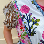 White cotton floral tiered maxi dress with flutter sleeves and ruffle collar