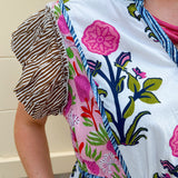 White cotton floral tiered maxi dress with flutter sleeves and ruffle collar