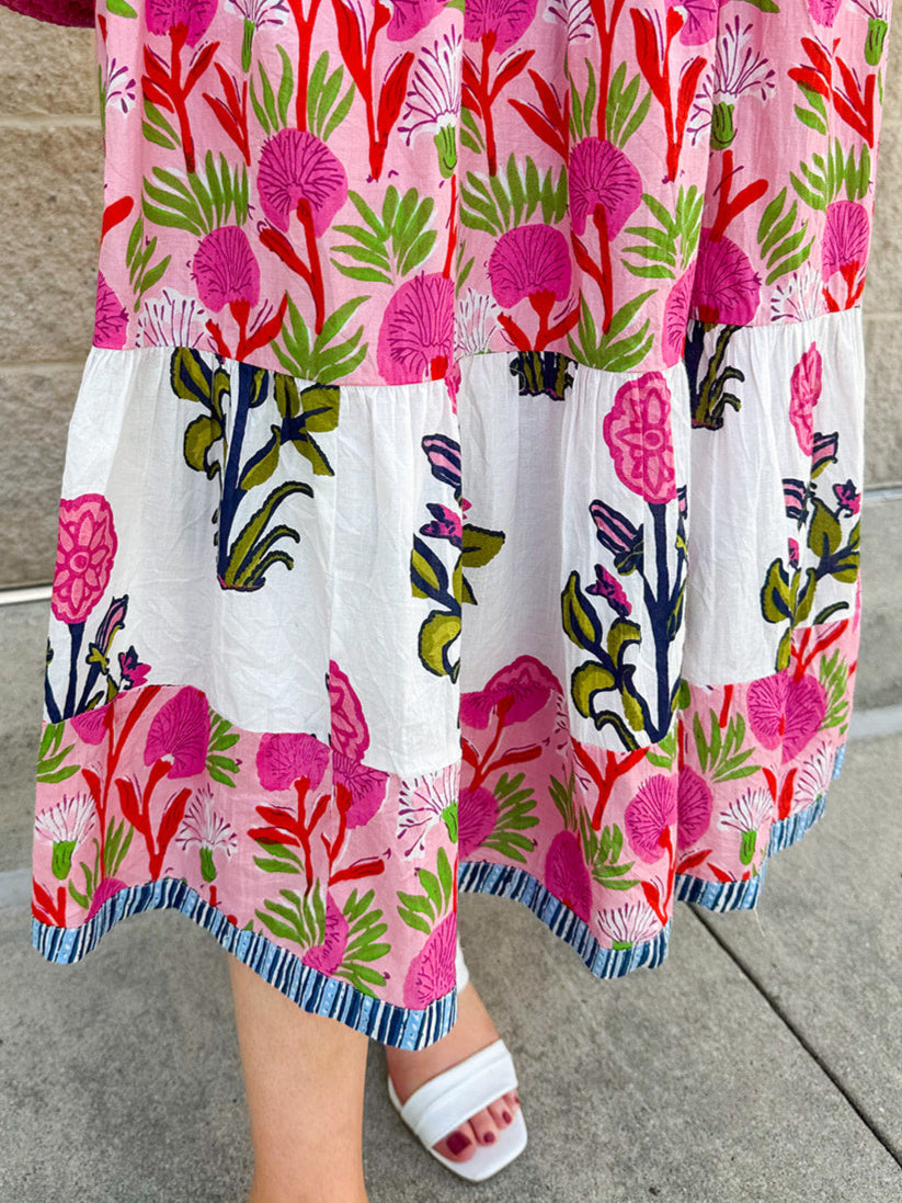 White cotton floral tiered maxi dress with flutter sleeves and ruffle collar
