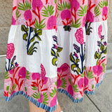 White cotton floral tiered maxi dress with flutter sleeves and ruffle collar