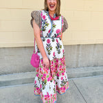 White cotton floral tiered maxi dress with flutter sleeves and ruffle collar