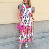 White cotton floral tiered maxi dress with flutter sleeves and ruffle collar