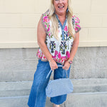 White cotton flutter sleeve top with floral print and ruffle neckline