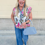 White cotton flutter sleeve top with floral print and ruffle neckline