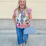 Medium wash wide leg jeans with mid rise, front seam, and front slits for a flattering, modern fit.
