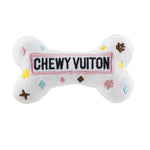 White plush bone-shaped dog toy with a designer-inspired print and squeaker.