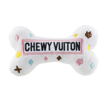 White plush bone-shaped dog toy with a designer-inspired print and squeaker.