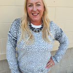 Wildly Pretty cream sweatshirt with allover cheetah print and cream neckline