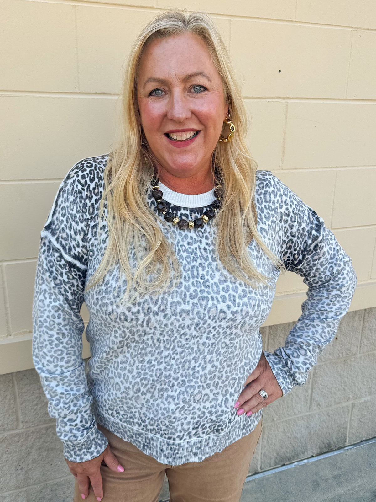 Wildly Pretty cream sweatshirt with allover cheetah print and cream neckline