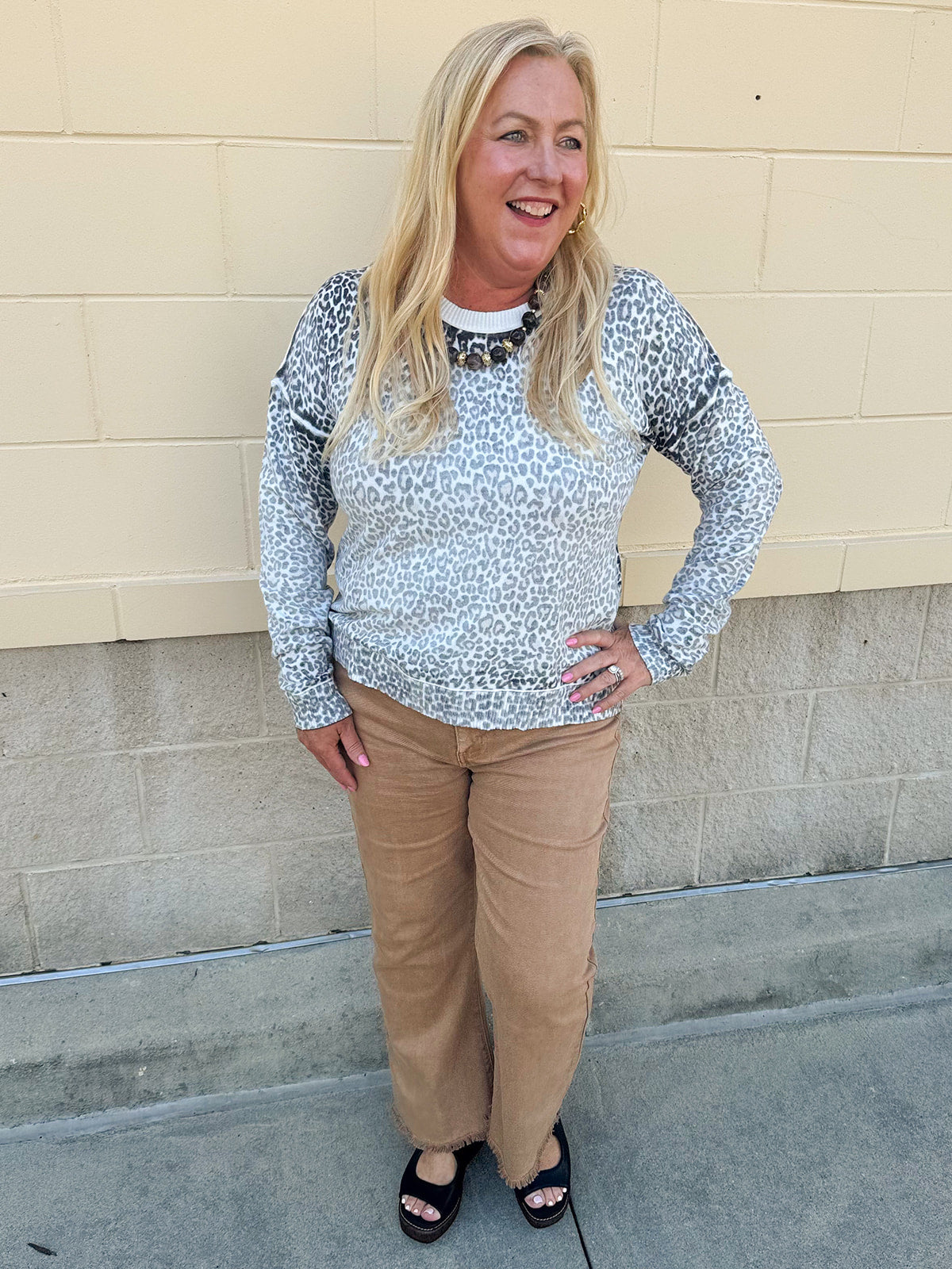 Wildly Pretty cream sweatshirt with allover cheetah print and cream neckline