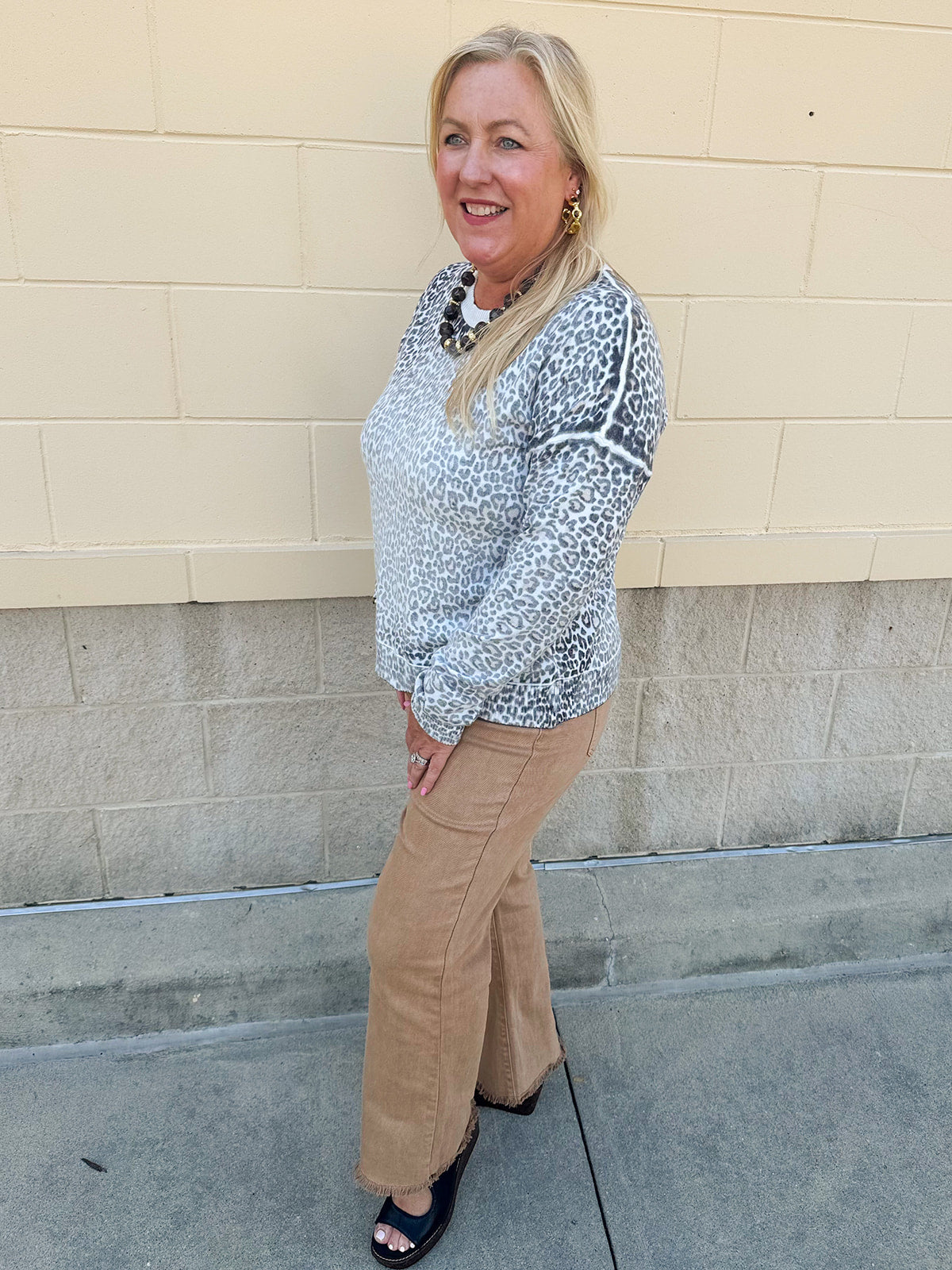 Wildly Pretty cream sweatshirt with allover cheetah print and cream neckline