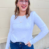 White brushed slub long sleeve tee with a crew neckline and regular fit.