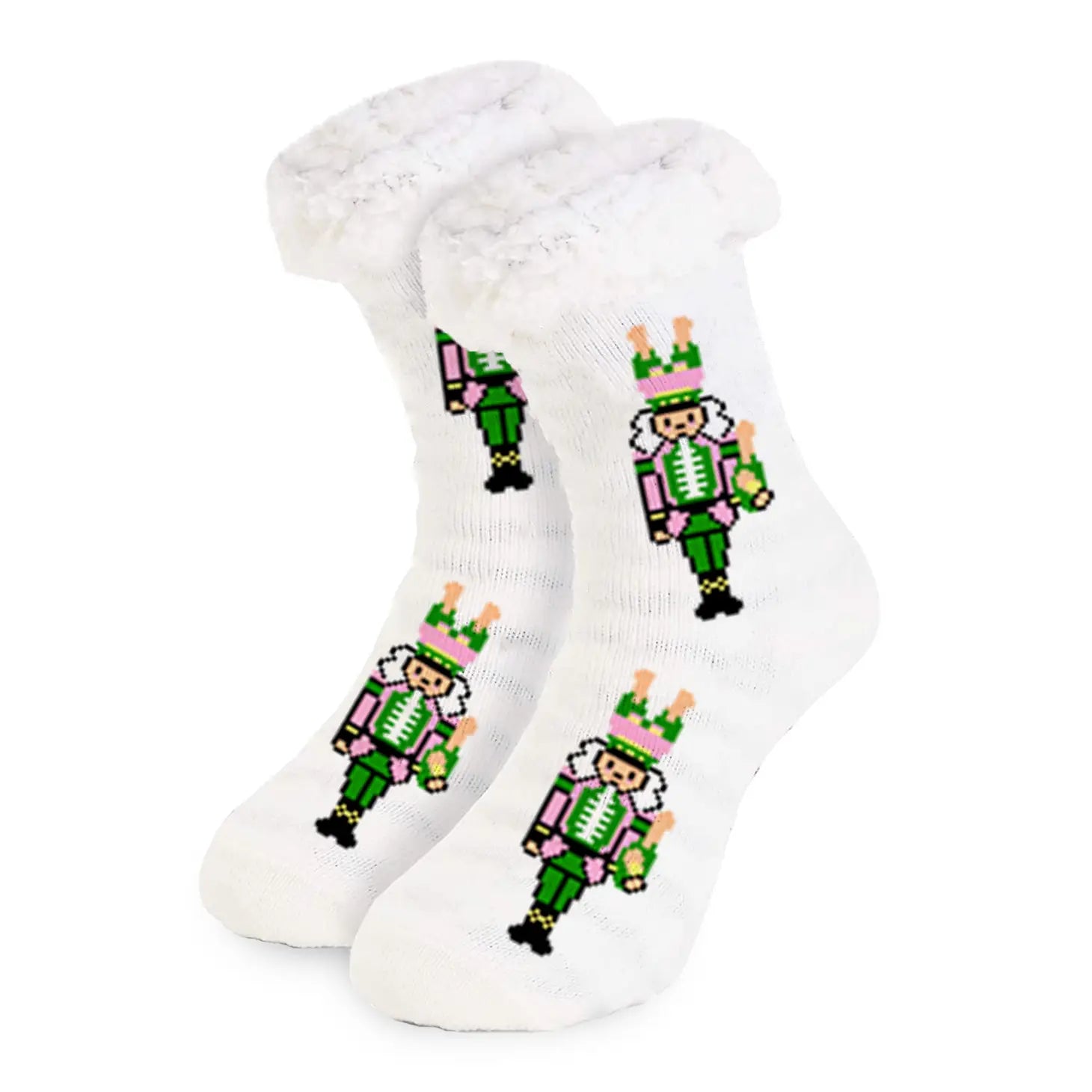Soft slipper socks with pink and green nutcracker design holding champagne bottles, fluffy cuff, and grip bottoms.