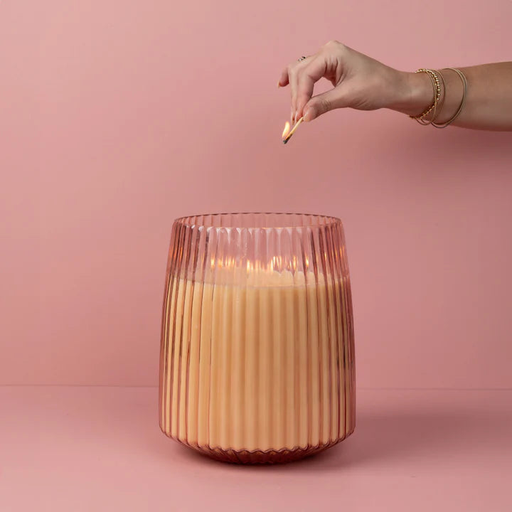 Pink textured glass candle with five wicks in a luxe, oversized design