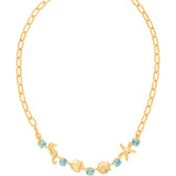 Necklace with alternating crystals and sea-themed charms on an adjustable chain.