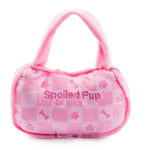 Pink checker plush handbag-shaped dog toy with a squeaker.