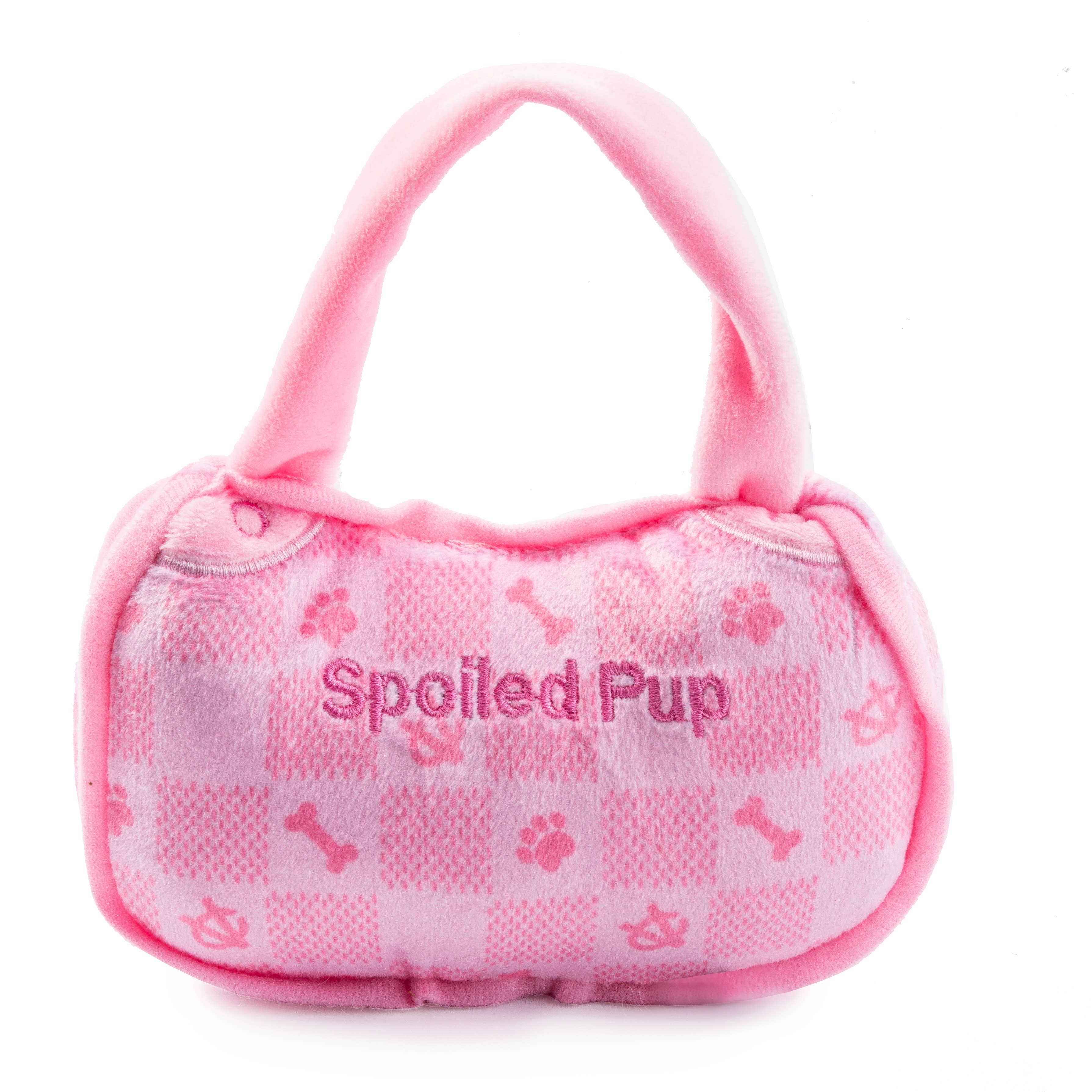 Pink checker plush handbag-shaped dog toy with a squeaker.