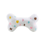 White plush bone-shaped dog toy with a designer-inspired print and squeaker.