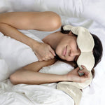 Bone-colored weighted eye sleep mask with microbead pods