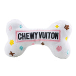 White plush bone-shaped dog toy with a designer-inspired print and squeaker.