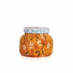 Capri Blue Holiday Pattern Play Pumpkin Dulce Candle 19oz with orange pumpkin leaf pattern and light blue lid.